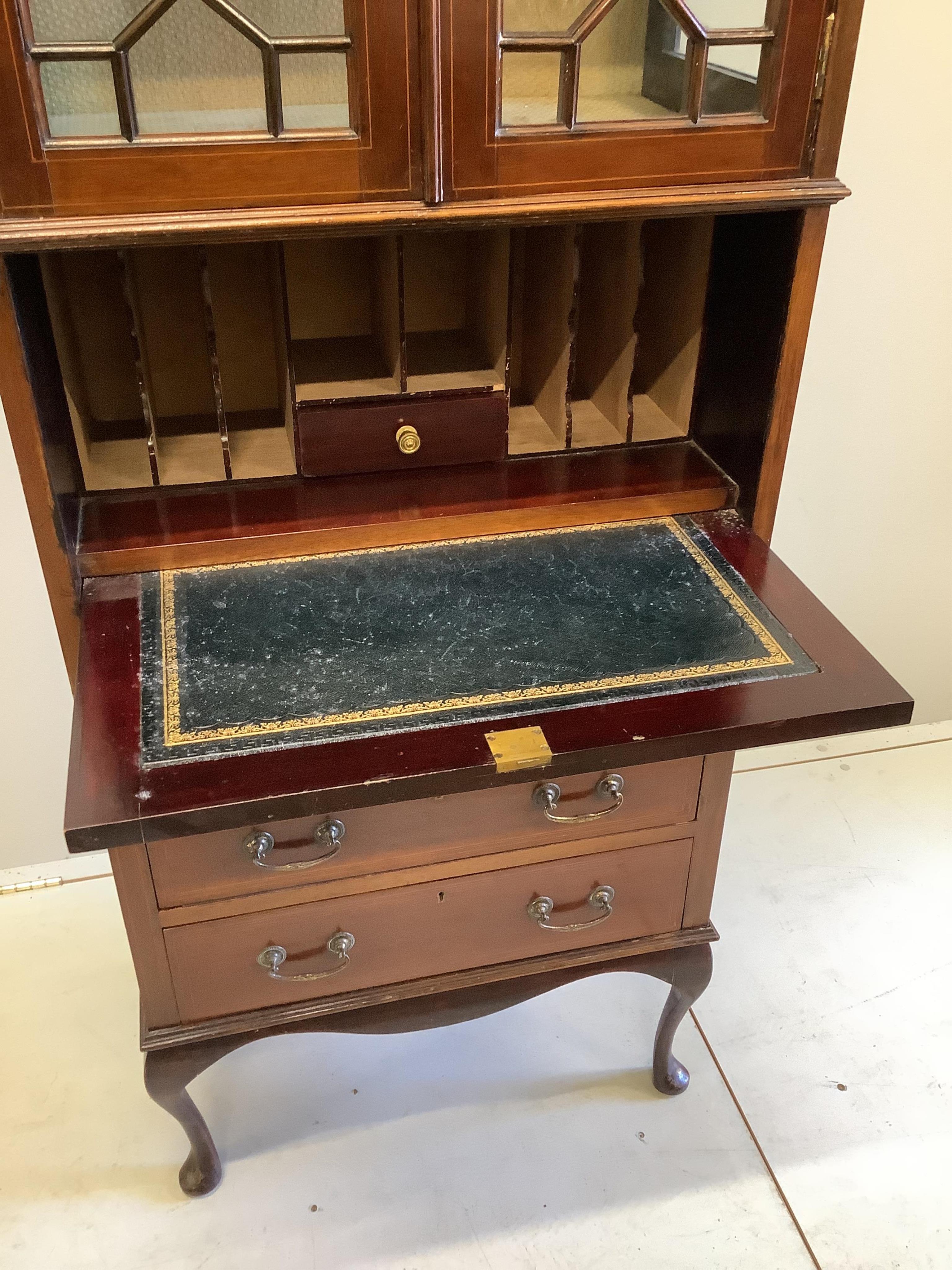 An Edwardian inlaid mahogany bureau cabinet, width 68cm, depth 42cm, height 179cm. Condition - fair